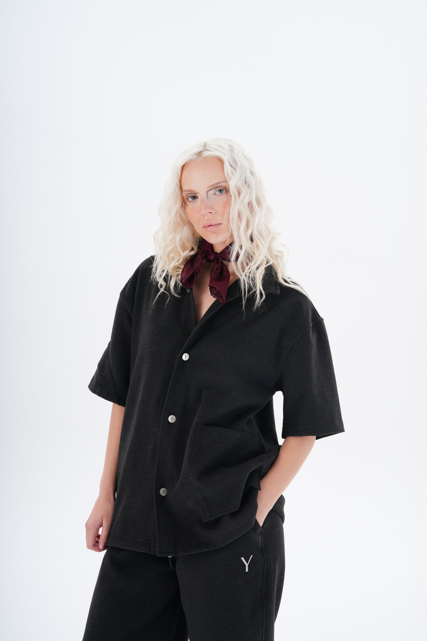 This minimalist button-up overshirt redefines casual luxury with its versatile design and bold character. Featuring a relaxed silhouette, short sleeves, and a structured collar, this piece bridges the gap between an overshirt and a light jacket. 