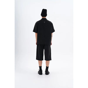 "Back view of the YAD Dark Grey Bermuda Shorts on a model - Showcasing the clean and minimalist design with a relaxed fit for contemporary urban wear."