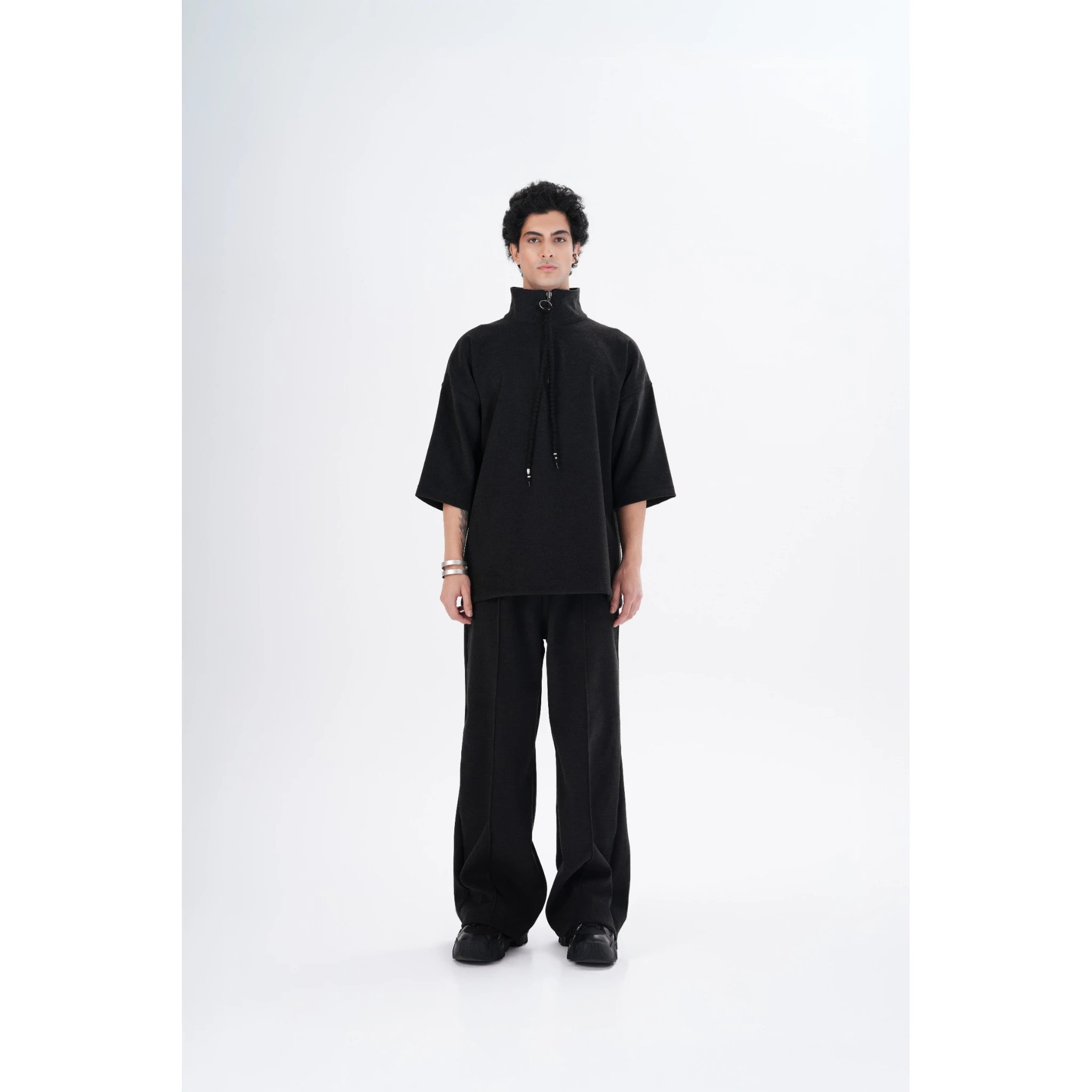 "YAD Dark Grey Pants and Top on a male model - Showcasing the minimalist and modern design with a relaxed fit for urban-inspired fashion."